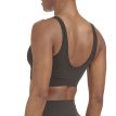 Nærbillede af ryggen på en model, der bærer Adidas Scoop Lounge Seamless Bra sports-bh (dame)