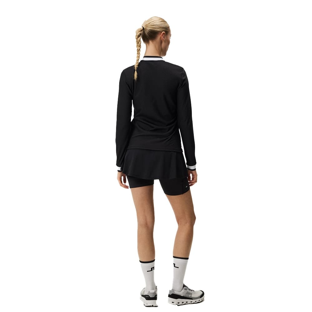 Bagside af J.Lindeberg Leonor Mid Layer (dame) på en model