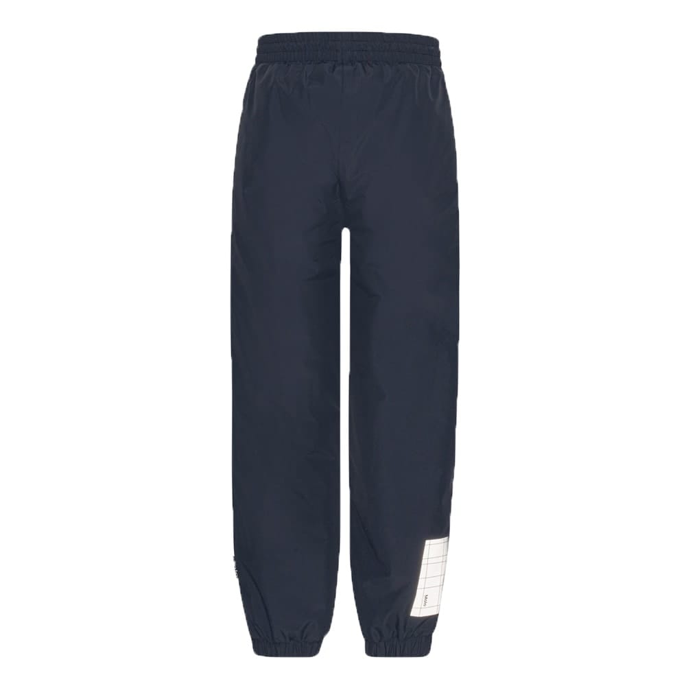 Et par praktiske og varmforede Molo Wild regnbukser (børn/junior) i navy - bagfra
