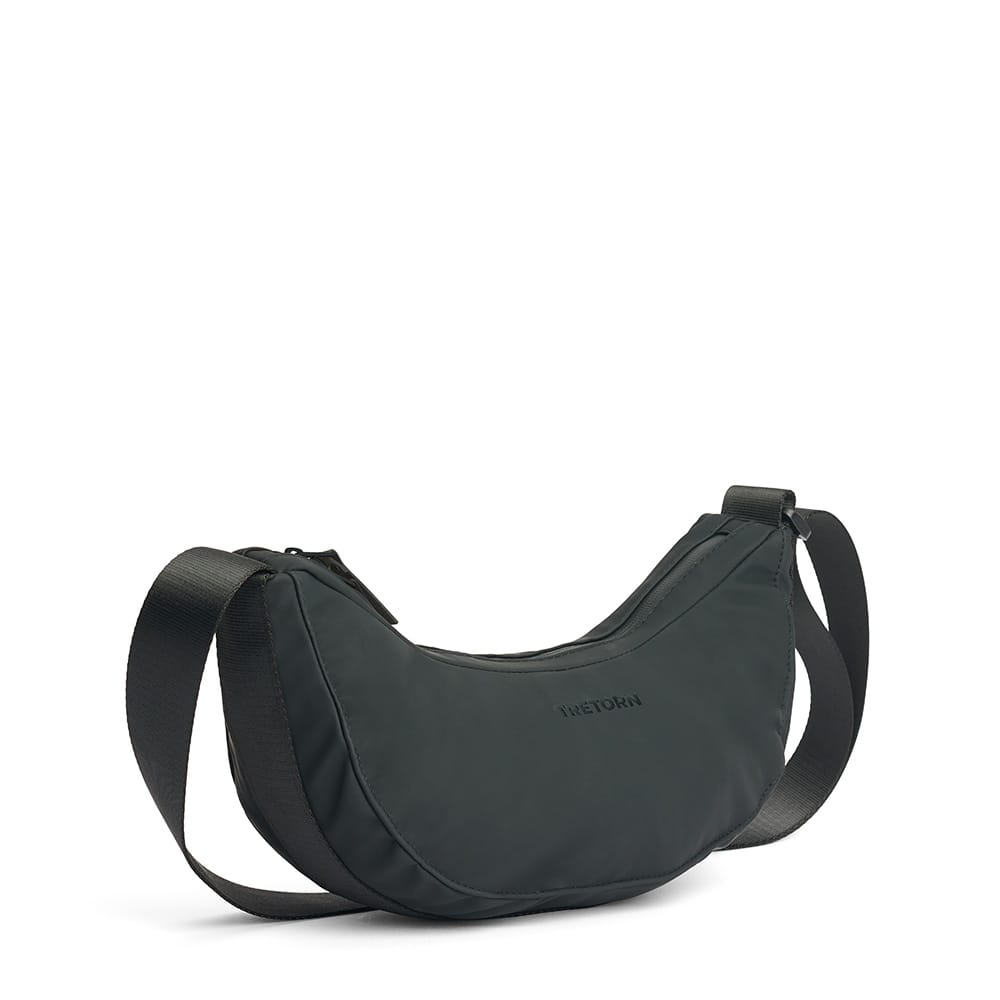Tretorn PU Moon Bag olkalaukku (unisex) sivulta viistosti kuvattuna